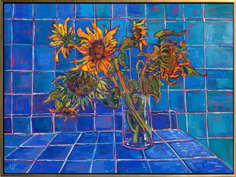A glass vase of sunflowers poses before a blue-tiled room. The vivid contrasting hues accentuate the contrasting textures and patterns within the painting. Thick brush strokes and vibrant color are reminiscent of the impressionists of the past.</p><p>"Blue Tiles and Sunflowers" is an original oil painting on stretched canvas. The piece arrives framed in a contemporary gold floater frame, ready to hang.