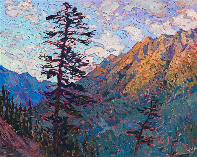 The last rays of the setting sun illuminate the mountain peaks in one of northern Washington's National Forests. Layers of tall pine trees cover the landscape in every direction, each tree with a distinct personality and shape. The brush strokes in this painting are loose and impressionistic, creating a lively mosaic of color and texture across the canvas.</p><p>This painting was done on 1-1/2" canvas, with the painting continued around the edges of the canvas, and it has been framed in a custom gold-leaf floater frame. The painting arrives ready to hang.