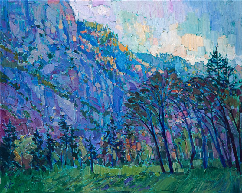 A contemporary impression of Yosemite, this painting captures the vivid colors seen just before sundown.  The cool tones of purple and ultramarine blue seem to glow from the canvas, interspersed with gleams of viridian green. The brush strokes are loose and impressionistic, full of life and movement.</p><p>This painting is framed in a gold floater frame, which leaves a narrow gap around the edge of the canvas. The painting arrives wired and ready to hang in your home.