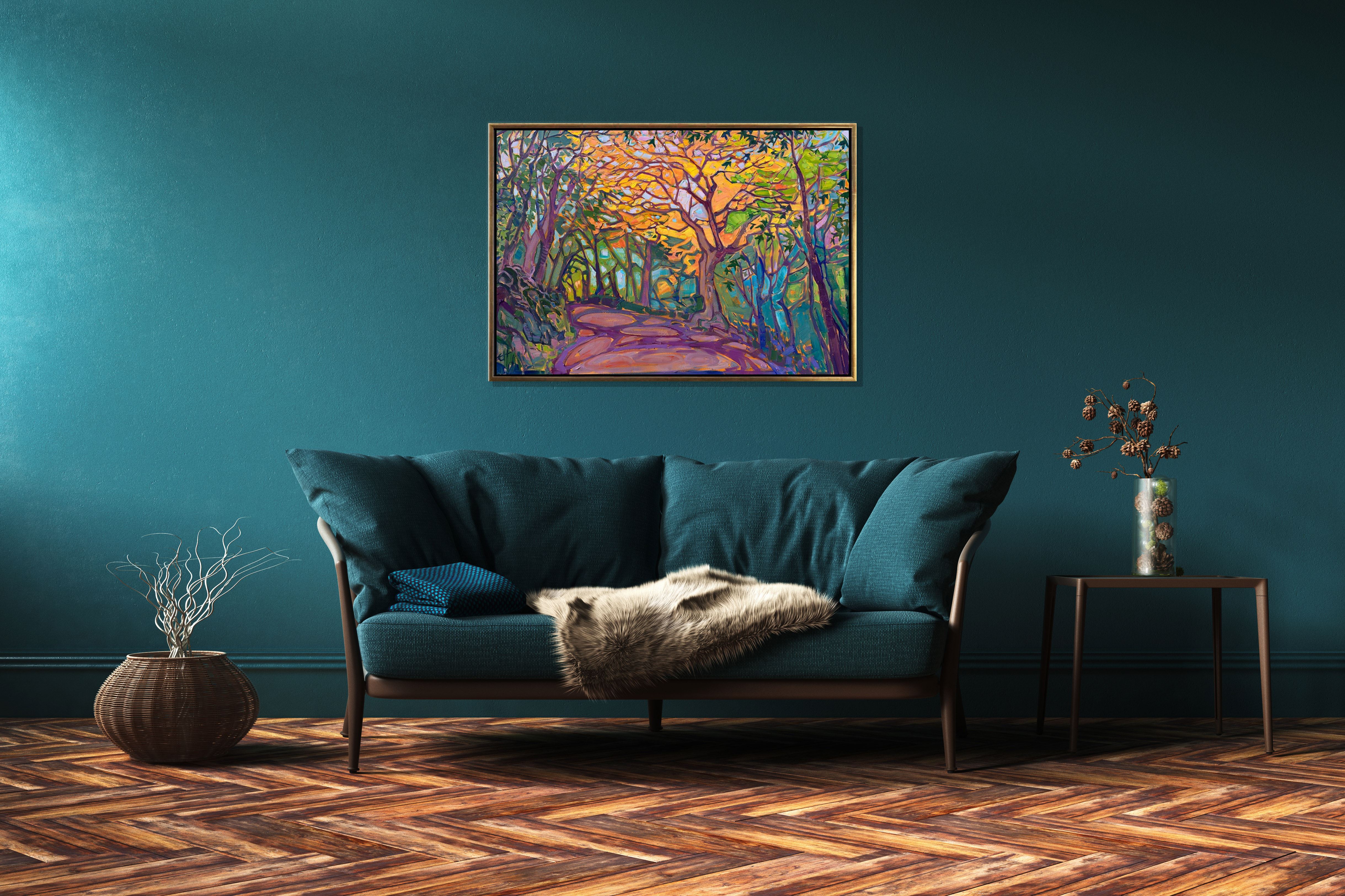 An Erin Hanson painting above a couch