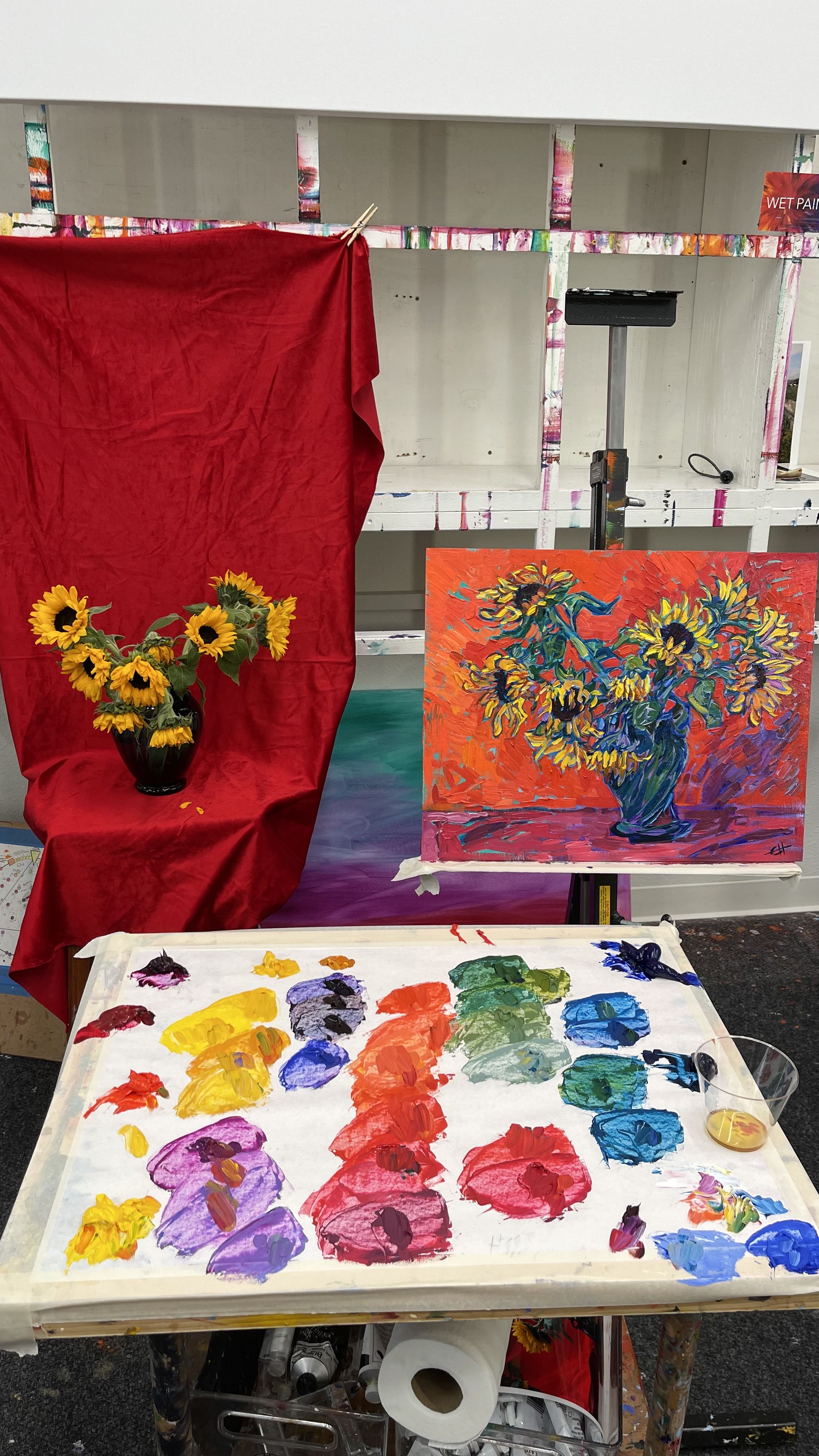 Erin Hanson sunflower painting in the studio