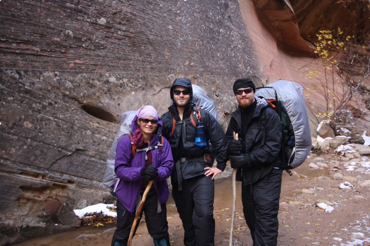 Erin backpacking with her brothers