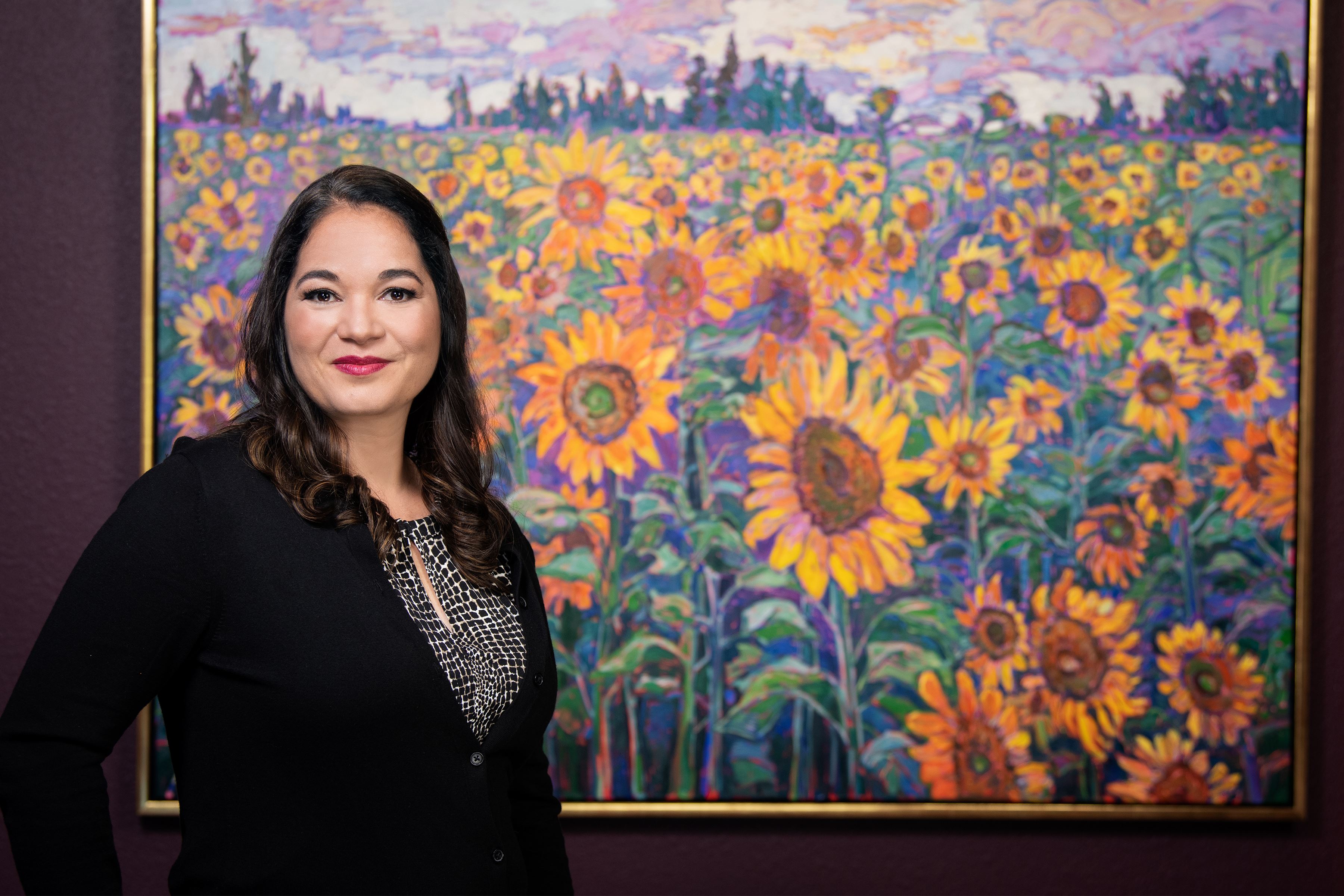 Erin Hanson with her painting Blooming Field