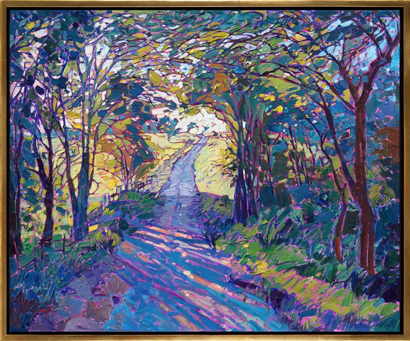 Oil painting of beautiful tree-lined pathway with sunlight seeping through by Erin Hanson framed in a gold floater frame