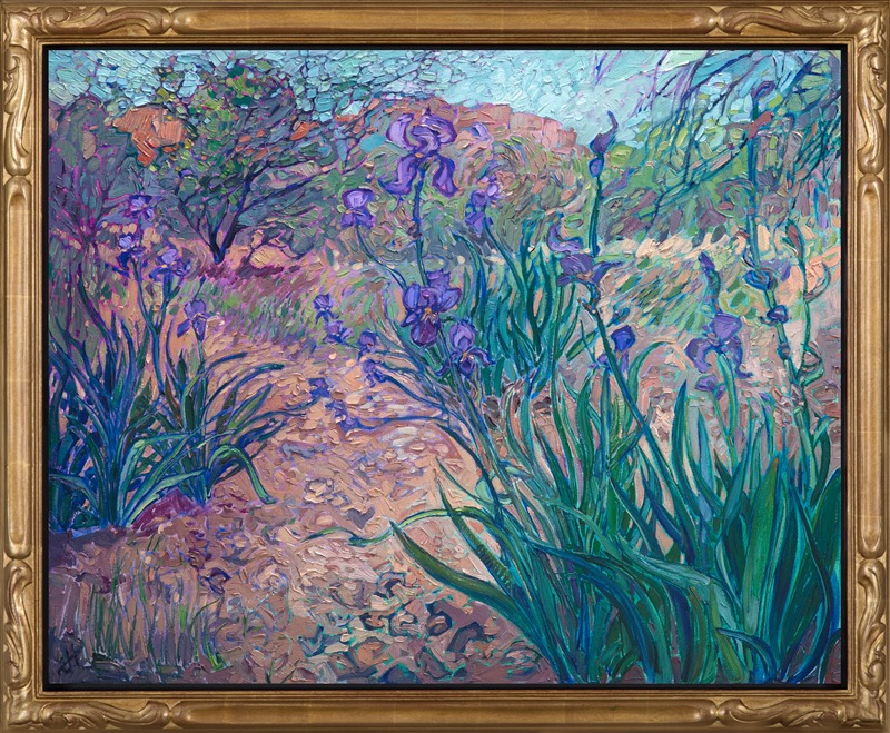 Oil painting of irises with red rock mountains in the background by contemporary impressionist artist Erin Hanson framed in a gold frame 