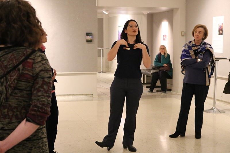 Erin Hanson speaking at an exhibition 5/7