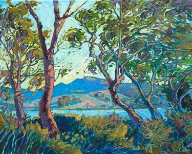 A tranquil scene of San Luis Obispo, inspired by a lake setting near Madonna Inn, is painted in lush impressionistic brush strokes and calming shades of blue and green. The wispy trees are alive with motion, a contrast against the distant still mountains.