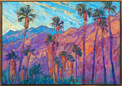 A line of palm trees stands before the San Jacinto mountains in Palm Springs. The steep desert mountains catch the first rays of dawn and turn fiery hues of orange and gold in the morning light. Thick brush strokes of oil paint capture the feeling of movement and vivacity of the scene.

"Mountain Palms II" is an original oil painting done on stretched canvas. The piece arrives framed in a custom-made, gold floater frame.