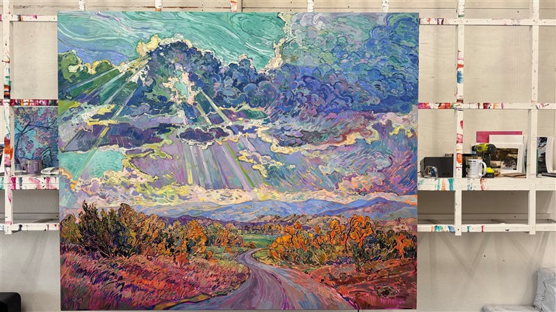 Rolling clouds hang low over the horizon, parting for the long rays of late afternoon sun to streak through and illuminate the ground below. The pathway leads you into the painting, into a world of beauty and light brought to life with thick, impasto brush strokes of oil paint. </p><p>Erin Hanson creates her Open Impressionism paintings using only five colors, and she tries not to overlap her brushstrokes, getting the painting "right the first time." The underpainting peeks out between the brush strokes, creating a mosaic, or stained glass, look to her paintings. This large painting will be displayed at "The Colossal Collection" at The Erin Hanson Gallery in August, 2025.
