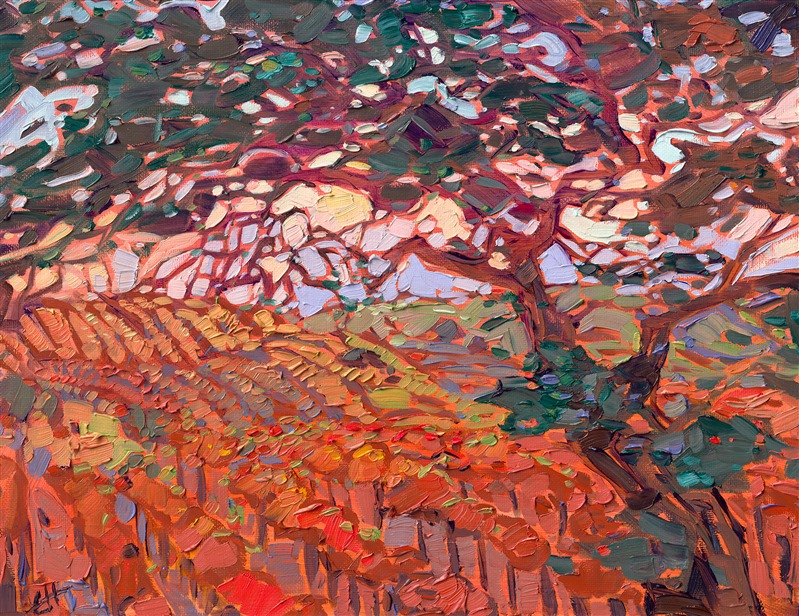 Autumn hues of gold and red linger in the air during this early-morning drive through Paso Robles wine country. The overhanging oak trees frame the softly rolling hills and their rows of vines.</p><p>"Autumn Fields" is an original oil painting created on linen board. The piece arrives framed in a classic black and gold plein air frame.