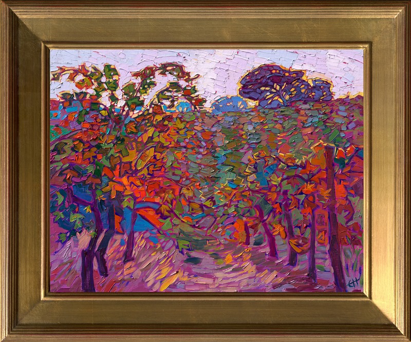An impressionistic flurry of autumn color, this petite oil painting captures the beauty of Paso Robles wine country in the fall. A periwinkle sky glows with hints of sunshine yellow, while the rows of vines glow with subtle color changes ranging from pumpkin orange to royal purple.</p><p>"Autumn Vines" was created on 1/8" linen board. The piece arrives framed in a gold plein air frame, ready to hang.