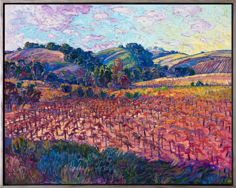 The rich, warm colors of autumn spread across this vineyards scene from central California. The vivid reds and yellow seem to glow upon the canvas. Each brush stroke is loose and impressionistic, bringing a sense of motion and vibrancy to the painting.</p><p>This painting has been framed in a custom-made, burnished silver floater frame. The piece was created on gallery-depth canvas, with the painting continued around the edges of the canvas.