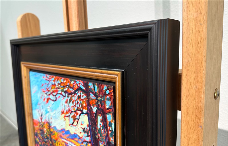A petite canvas captures the wide landscape and vivid fall colors of the Blue Ridge Mountains in South Carolina. Blue Ridge Parkway is the most-traveled highway in the U.S., as leaf peepers from far and wide gather to see the brilliant fall foliage.</p><p>"Blue Ridge Vista" is an original oil painting on linen board. The piece arrives framed in a classic black and gold plein air frame, ready to hang.