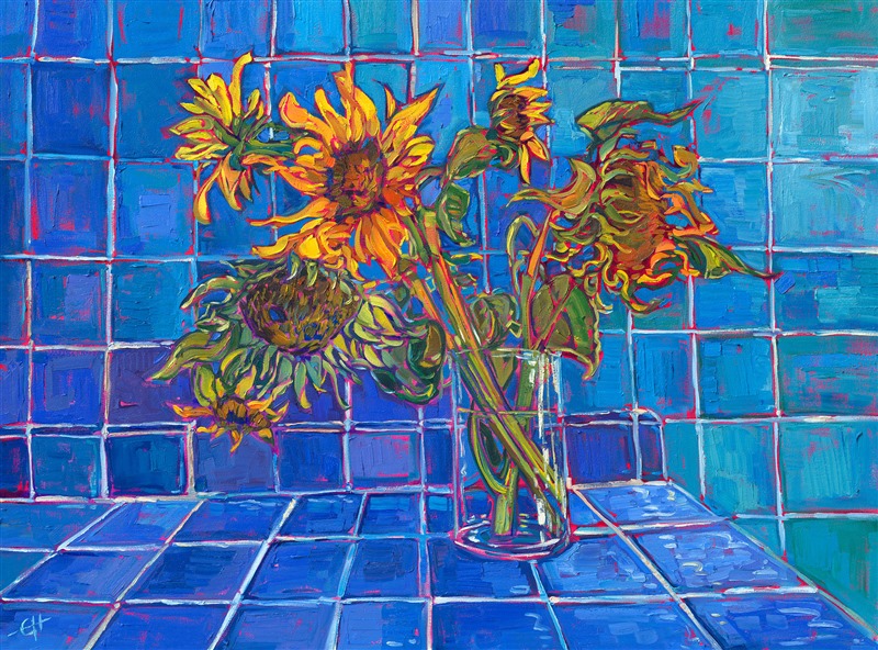 A glass vase of sunflowers poses before a blue-tiled room. The vivid contrasting hues accentuate the contrasting textures and patterns within the painting. Thick brush strokes and vibrant color are reminiscent of the impressionists of the past.</p><p>"Blue Tiles and Sunflowers" is an original oil painting on stretched canvas. The piece arrives framed in a contemporary gold floater frame, ready to hang.