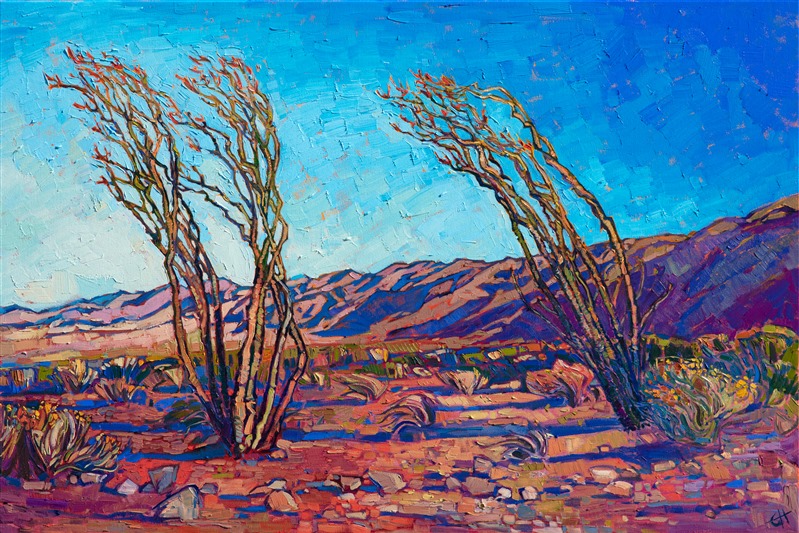 A pair of ocotillo stand blooming in the southern end of Joshua Tree National Park. The early morning light casts sheets of warm color across the desert landscape. Each brush stroke seems to revel in the beauty of the outdoors.</p><p>"California Ocotillo" original oil painting was created on 1-1/2" canvas, with the edges of the canvas painted. The piece has been framed in a custom gold floater frame.