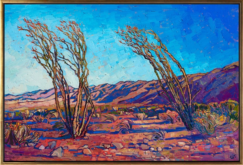 A pair of ocotillo stand blooming in the southern end of Joshua Tree National Park. The early morning light casts sheets of warm color across the desert landscape. Each brush stroke seems to revel in the beauty of the outdoors.</p><p>"California Ocotillo" original oil painting was created on 1-1/2" canvas, with the edges of the canvas painted. The piece has been framed in a custom gold floater frame.