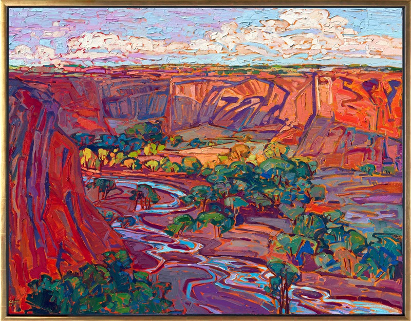 The brilliant hues of dawn illuminate the red rock cliffs of Canyon de Chelly, Arizona. The summer-green cottonwoods gleam with warm yellow light, and the winding stream reflects the blue morning sky above.</p><p>"Canyon de Chelly Dawn" was created on gallery depth linen canvas, and the painting arrives framed in a contemporary gold floater frame, ready to hang.