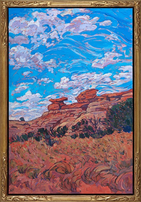 Cheerful summer clouds glide across a desert blue sky in this painting of Canyonlands National Park, Utah. This national park takes up a huge expanse of land and contains myriad red rock formations, canyon systems, and mesas.  This painting was inspired by a hike through the red rock formations in the Needles district.</p><p>This painting was done on 1-1/2" canvas, with the painting continued around the edge of the canvas.  This piece has been framed in a beautiful, hand-carved open impressionist frame.</p><p>Exhibited: <a href="https://www.erinhanson.com/Event/redrock2018" target=_blank"><i>The Red Rock Show</i></a> at The Erin Hanson Gallery, 2018.  <a href="https://www.erinhanson.com/Portfolio?col=The_Red_Rock_Show_2018" target="_blank"><u>Click here</u></a> to view the other Red Rock paintings.