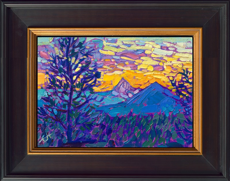 This petite work captures the vibrant blues and purples you can see in the Oregon Cascades at sunset. The sky glows a rich, coppery yellow.</p><p>"Cascades Blues" is an original oil painting on linen board. The piece arrives in a mock floater frame finished in black with gold edging.</p><p>This piece will be displayed in Erin Hanson's annual <i><a href="https://www.erinhanson.com/Event/petiteshow2023">Petite Show</i></a> in McMinnville, Oregon. This painting is available for purchase now, and the piece will ship after the show on November 11, 2023.