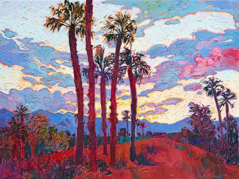 A dramatic desert sunset blooms with color above the Coachella Valley. Narrow palm trees stretch into the sky, completing the picture of desert beauty. The brush strokes are thick and impressionistic, alive with color and motion.</p><p>"Coachella Sunset" was created on 1-1/2" canvas, with the painting continued around the edges. The piece arrives framed in a contemporary gold floater frame, pictured above.