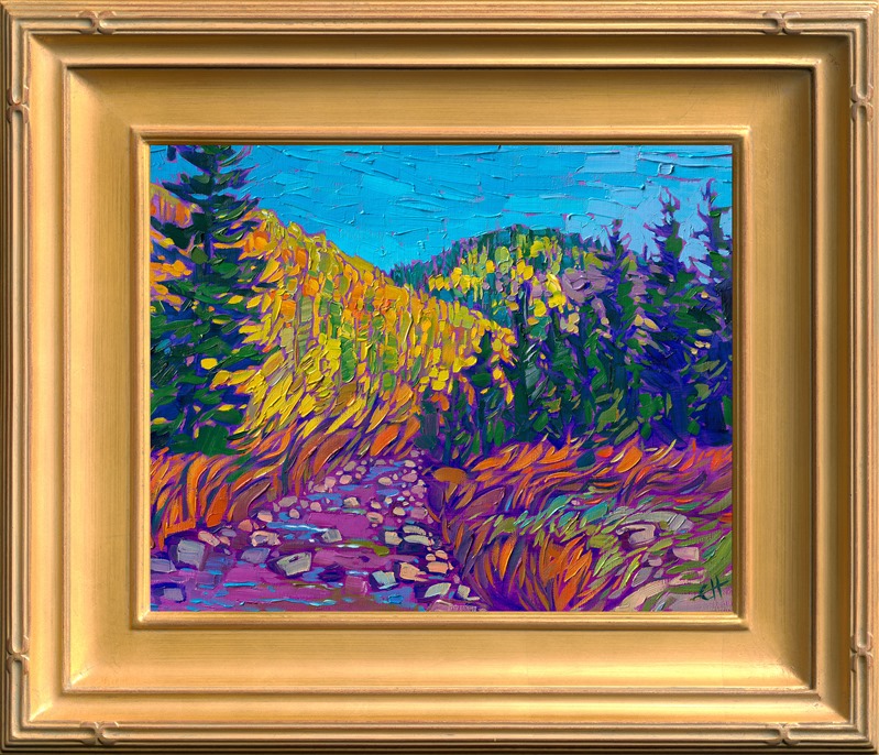 Colorado aspens cover the mountainsides above a winding stream. The bright blue autumn sky is a brilliant contrast against the autumn yellows and jewel-toned evergreens.</p><p>"Colorado Aspens" was created on fine linen board, and it arrives framed in a pale gold plein air frame.