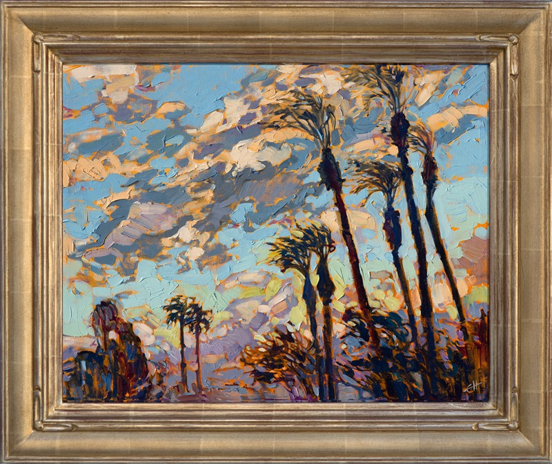 A brilliant blue sky and dramatic clouds form the backdrop to this California desert landscape. The desert has some of the most colorful skies I have ever seen.  With the wind blowing briskly and the air dry and fresh, there is no better place to enjoy the outdoors.</p><p>This small impressionistic painting has been framed in a beautiful hand-carved, gilded frame.  It would be a show-stopper in any room.