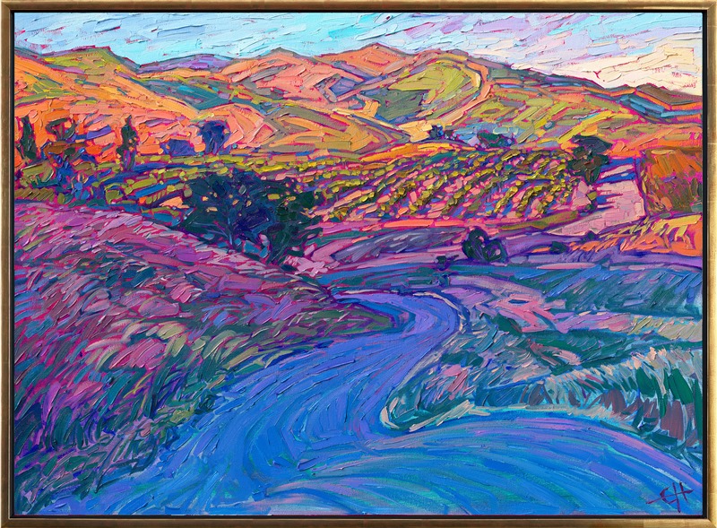 The vineyard-covered hills of Paso Robles, California, catch the early morning light in this idyllic scene. Rich hues of burnt orange and pink sherbet dance across the grassy hills, while the road in the foreground is colored in cool, shadowy hues of blue and purple.</p><p>"Dawning Vines" is an original oil painting by Erin Hanson, created in her signature Open Impressionism style. The brush strokes are loose and thickly textured, alive with color and motion.