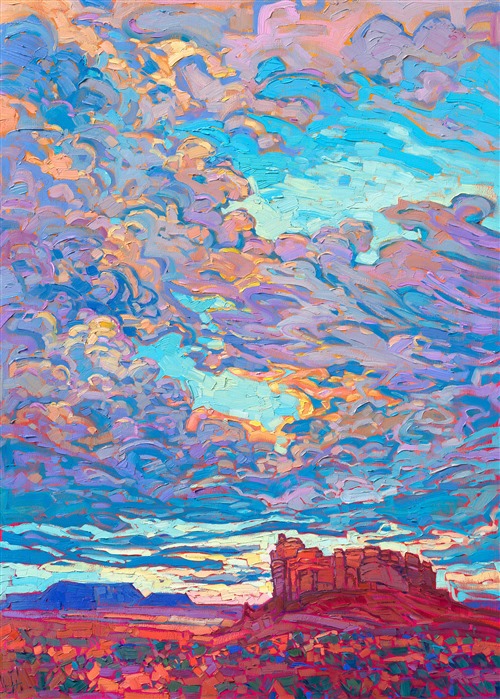 A summer sky bursts with color over the Four Corners region near Monument Valley. The impasto brush strokes capture the movement and joy of this colorful landscape. </p><p>"Desert Clouds" was created on gallery-depth canvas, and the painting arrives framed in a contemporary gold floater frame, ready to hang.