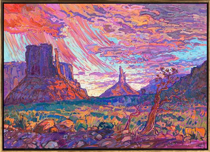 Deep in Monument Valley, standing between the looming Mittens, a passing monsoon showered down upon the red desert earth. The buttes glowed pink and purple in the light of the setting sun, while the green and gold desert shrubs glinted in the fading light.</p><p>"Desert Monsoon" is an original oil painting created on stretched canvas and framed in a contemporary gold floater frame.