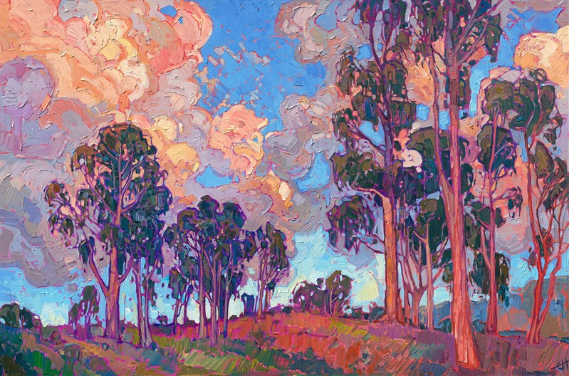 San Diego eucalyptus trees stand in silhouette against a sunset sky. The large billowing clouds are often seen rolling in off the coast, and when the sun goes down they turn brilliant shades of orange sherbet and lavender. This painting captures all the beauty of this transient light. 

"Diego Eucalyptus" was created on 1-1/2" canvas, with the painting continued around the edges. The piece arrives framed in a 23kt gold floater frame.
