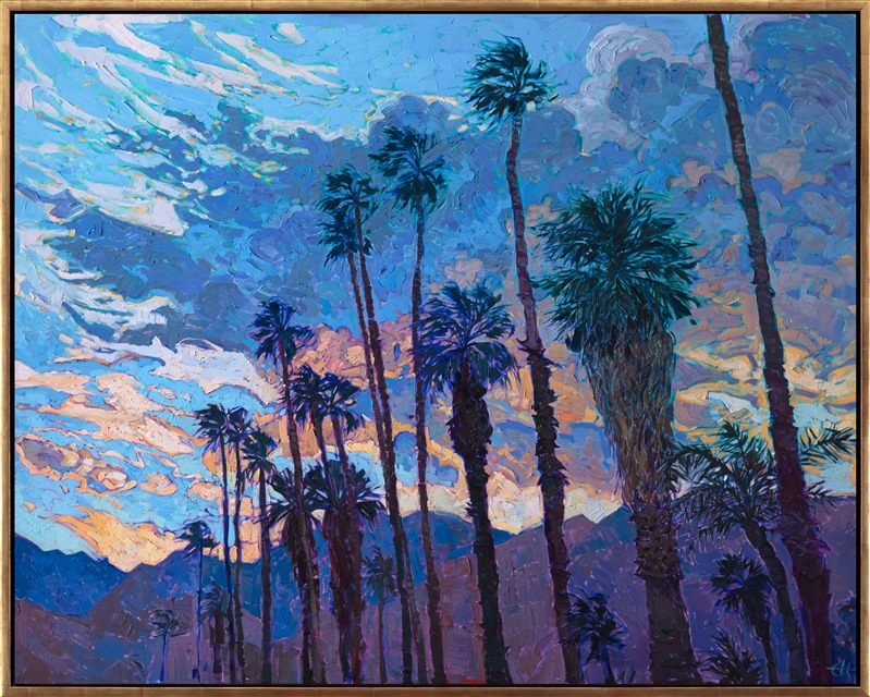 The last light of a setting sun illuminates this desert landscape, the tall California palms silhouetted against the colorful clouds. The brush strokes in this painting are loose and impressionistic, alive with color and texture.</p><p>This painting was done on 1-1/2" canvas, with the painting continued around the edges. The piece has been framed in a custom gold floating frame. 