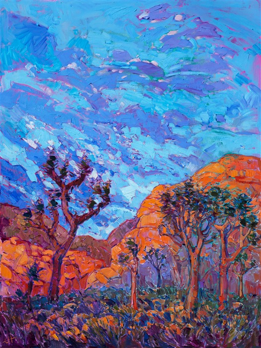 The warm desert light of southern California crests over these rounded granite boulders of Joshua Tree National Park.  No matter how many times one visits this park, each dawn is always a brand new revelation of color and striking contrasts of form.  This painting captures the vivid and surreal nature of this beautiful landscape.</p><p>This painting was done on 1-1/2-deep canvas, with the painting continued around the edges. The piece has been framed in a gold floater frame.</p><p>Exhibited <a href="https://www.erinhanson.com/Event/ErinHansonTheOrangeShow"><i>The Orange Show</i></a>, The Erin Hanson Gallery, Los Angeles, CA. 2016.