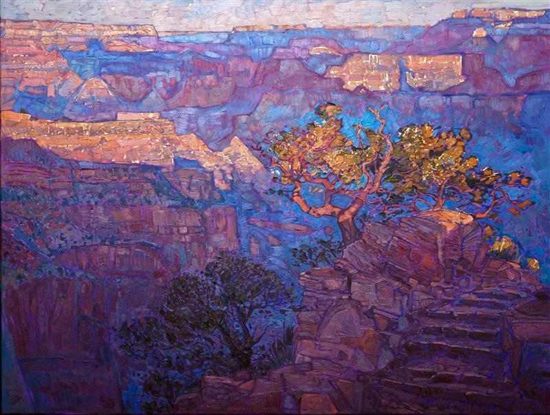 I started hiking down into the Grand Canyon one early morning, 2 hours before dawn. The trailhead began way back from the main canyon, a few miles' hike from the first uninterrupted view where you could see the wide expanse of the canyon. As I hiked along with my two brothers, large packs on our backs, I watched the sky slowly lighten above us.  Eventually, we no longer needed our headlamps, and I could make out the dim shape of the steep cliff beside us.  As the hour of daybreak approached nearer, I started jogging anxiously forward, hoping to catch that magical moment of dawn hitting the Grand Canyon.  The trail kept switching back and forth behind a large outcropping in the cliff, and I could not get a full view of the canyon.  In the distance, I could see the sun starting to hit the first tips of the distant peaks.  I urged my brothers forward, trotting forward at a near gallop now, and when the trail finally led me around the final switchback and out into an unimpeded view of the canyon, I skidded to a stop.  This is the vision I saw: an ancient manzanita tree catching the bright rays of the sun, mere minutes after daybreak, with the wide expanse of the canyon as the backdrop. In my painting can see the sunlight striking the top of the boulder next to the trail -- five minutes later and the entire trail was bathed in warm light.  Five minutes after that, and the Grand Canyon itself was fully lit from top to bottom, and the dramatic and mystical period of dawn had passed.  The colors changed rapidly from brilliant gold and purple to a dull orange and brown.  I was so happy I had made it to this spot in the trail in time, and I took about a hundred photos during those subsequent minutes, recording the sun slowly descending down the canyon walls.</p><p>This painting captures the moment of first light I experienced as I came around that final bend in the Grand Canyon.</p><p>This painting was done over a unique underpainting: where the sunlight is hitting the mountains and tree, I applied 24kt gold leaf beneath the oil paint.  The effect is subtle, but at the right angle you can see a little glimmer of gold peeking through the brushstrokes. This painting was done on 1-1/2" canvas, with the painting continued around the edges.  It has been framed in a gilded and hand-carved floater frame.</p><p>This painting will be shown in the <a href="https://www.erinhanson.com/Event/redrock2018" target=_blank"><i>The Red Rock Show</i></a> at The Erin Hanson Gallery, June 16th, 2018.  <a href="https://www.erinhanson.com/Portfolio?col=The_Red_Rock_Show_2018" target="_blank"><u>Click here</u></a> to view the other Red Rock paintings.