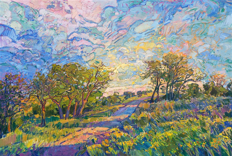 The gently rolling hills of Texas Hill Country are captured here in thickly applied brush strokes of impressionistic oil paint, the warm colors of spring coming alive on the canvas.  The yellow wildflowers add a sense of joy and movement to the piece.</p><p>This painting was done on 1-1/2" canvas, with the painting continued around the edges.  The painting has been framed in a 23kt gilded, contemporary floater frame.
