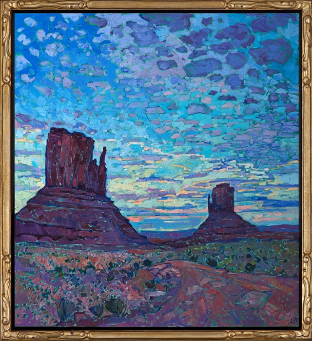 Anyone who has seen a sunset over Monument Valley will never forget it.  As the world slowly darkens and the landscape hushes, the sky celebrates the closing of another day with brilliant hues and cloud formations.  This painting captures that transient moment in time with thick, impasto brush strokes and expressionistic color.</p><p>This painting was done on 1-1/2" canvas, with the painting continued around the edges.  It has been framed in a gilded and hand-carved floater frame.</p><p>--- </p><p>Monument Valley<br/><B>F U N   F A C T S</B></p><p>Formed during the Permian period (50 million years before dinosaurs roamed the earth), this patch of land once formed part of a seafloor where sediments and sandstone piled up in layers for millions of years. The Valley is now a sacred place for the Navajo, whose mythology holds that these grand spires contain the spirits of Najavo warriors. Monument Valley is found on the Navajo National Reservation. </p><p>The Valley is also one of the most filmed spots in the history of filmmaking. The valley was hailed "John Wayne country" for appearing in no less than five of his movies. It also served as a backdrop for an iconic scene in Forest Gump. </p><p>"There are certain places in the world that seem like special effects, they don't seem real," said film historian Scott Eyman. "They're too perfect. And the first time you come here, you see it through John Ford's eyes." (Ford is widely regarded as one of the most important and influential film-makers in history.)</p><p>--</p><p>This painting was a part of the <a href="https://www.erinhanson.com/Event/redrock2018" target=_blank"><i>The Red Rock Show</i></a> in San Diego in 2018.  <a href="https://www.erinhanson.com/Portfolio?col=The_Red_Rock_Show_2018" target="_blank"><u>Click here</u></a> to view the other Red Rock paintings.<br/>