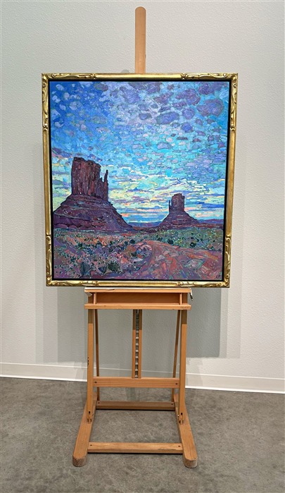 Anyone who has seen a sunset over Monument Valley will never forget it.  As the world slowly darkens and the landscape hushes, the sky celebrates the closing of another day with brilliant hues and cloud formations.  This painting captures that transient moment in time with thick, impasto brush strokes and expressionistic color.</p><p>This painting was done on 1-1/2" canvas, with the painting continued around the edges.  It has been framed in a gilded and hand-carved floater frame.</p><p>--- </p><p>Monument Valley<br/><B>F U N   F A C T S</B></p><p>Formed during the Permian period (50 million years before dinosaurs roamed the earth), this patch of land once formed part of a seafloor where sediments and sandstone piled up in layers for millions of years. The Valley is now a sacred place for the Navajo, whose mythology holds that these grand spires contain the spirits of Najavo warriors. Monument Valley is found on the Navajo National Reservation. </p><p>The Valley is also one of the most filmed spots in the history of filmmaking. The valley was hailed "John Wayne country" for appearing in no less than five of his movies. It also served as a backdrop for an iconic scene in Forest Gump. </p><p>"There are certain places in the world that seem like special effects, they don't seem real," said film historian Scott Eyman. "They're too perfect. And the first time you come here, you see it through John Ford's eyes." (Ford is widely regarded as one of the most important and influential film-makers in history.)</p><p>--</p><p>This painting was a part of the <a href="https://www.erinhanson.com/Event/redrock2018" target=_blank"><i>The Red Rock Show</i></a> in San Diego in 2018.  <a href="https://www.erinhanson.com/Portfolio?col=The_Red_Rock_Show_2018" target="_blank"><u>Click here</u></a> to view the other Red Rock paintings.<br/>