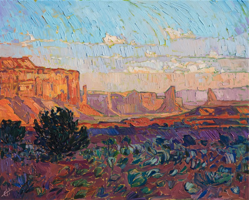 Watching dawn over Monument Valley is a breathtaking experience.  Each new minute brings a fresh vista of color before you, an ever-changing kaleidoscope of red rock hues. This painting was created with thick, impressionistic brush strokes of oil paint.</p><p>This painting was done on 1-1/2" canvas, with the painting continued around the edges of the canvas, and it has been framed in a custom, gold-leaf floater frame. The painting arrives ready to hang.