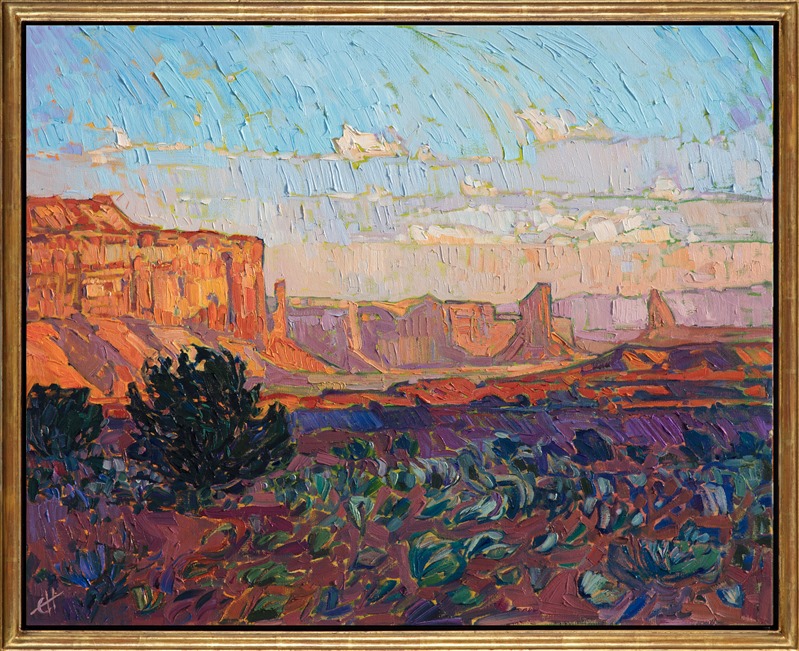 Watching dawn over Monument Valley is a breathtaking experience.  Each new minute brings a fresh vista of color before you, an ever-changing kaleidoscope of red rock hues. This painting was created with thick, impressionistic brush strokes of oil paint.</p><p>This painting was done on 1-1/2" canvas, with the painting continued around the edges of the canvas, and it has been framed in a custom, gold-leaf floater frame. The painting arrives ready to hang.