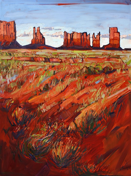 A rainbow of color highlights the red rock landscape of Monument Valley, Utah.
