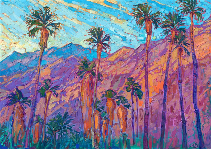 A line of palm trees stands before the San Jacinto mountains in Palm Springs. The steep desert mountains catch the first rays of dawn and turn fiery hues of orange and gold in the morning light. Thick brush strokes of oil paint capture the feeling of movement and vivacity of the scene.</p><p>"Mountain Palms II" is an original oil painting done on stretched canvas. The piece arrives framed in a custom-made, gold floater frame.