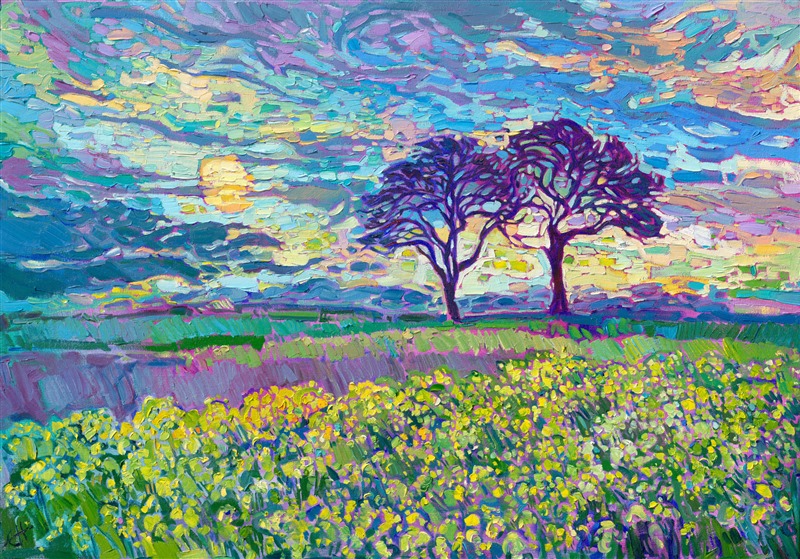 This painting captures a pair of oak trees standing above a field of mustard flowers in Oregon's Willamette Valley. Oregon's countryside is not only home to beautiful vineyards, but also flower fields, mustard plants, and hazelnut groves. This scene is captured with thick, impasto brush strokes laid side-by-side without layering, in Erin Hanson's iconic Open Impressionism style.