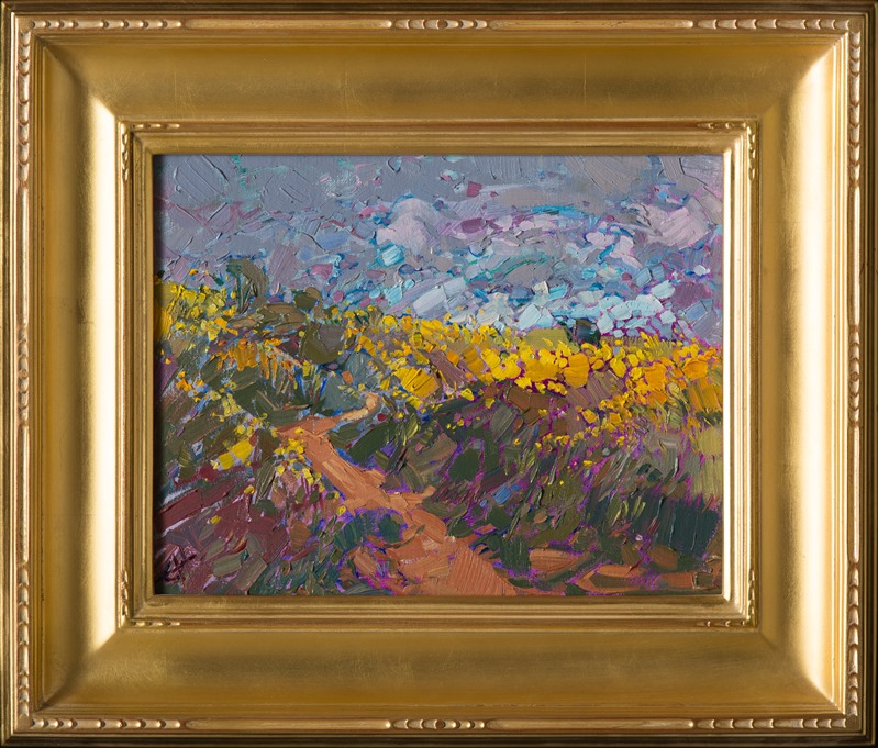 Cadmium yellow mustard flowers cover the top of this hill, the small flowers catching the light and contrasting against the darker clouds.  Each impasto brush stroke is lively and full of motion, capturing the wide outdoors on a small canvas.</p><p>This painting was created on canvas board and arrives framed in a beautiful gilded frame, ready to hang.