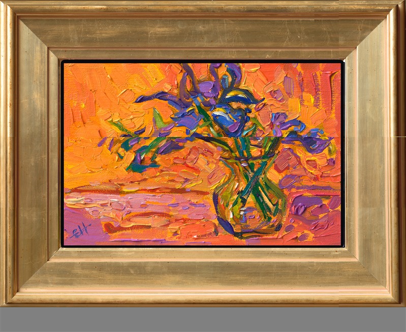 This petite painting captures the impression of purple irises in a vase against an orange backdrop. The loose, expressive brushstrokes give this small canvas a painterly feel.</p><p>"Petite Irises" is an original oil painting on linen board. The piece arrives framed in a wide, custom frame designed to set off the colors in the piece.