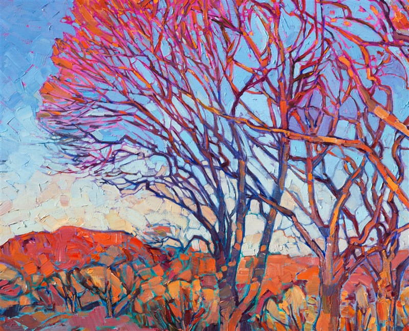 The last radiant rays of sunlight hit these wintery cottonwoods in St. George, Utah, each branch vibrant with striking color.  The distant red rock cliffs add a bolt of orange to the painting, a beautiful contrast against the January sky.  This contemporary impressionist piece employs thickly applied brush strokes to capture the motion of the wide outdoors.</p><p>This painting has been framed in a custom 22kt gold leaf, hand-carved floater frame. Read more about the <a href="https://www.erinhanson.com/Blog?p=AboutErinHanson" target="_blank">painting's details here.</a></p><p>Exhibited <a href="https://www.erinhanson.com/Event/ErinHansonTheOrangeShow"><i>The Orange Show</i></a>, The Erin Hanson Gallery, Los Angeles, CA. 2016.
