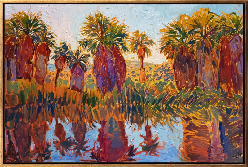 The shaggy trunks of a grove of desert palms are reflected in the still pools of Thousand Palms Oasis, in the Coachella Valley, California. The impressionistic brush strokes are loose and painterly, capturing the dynamic color of the high desert.</p><p>"Reflected Palms" was created on 1-1/2" canvas, with the painting continued around the edges. The piece arrives framed in a contemporary gold floater frame.