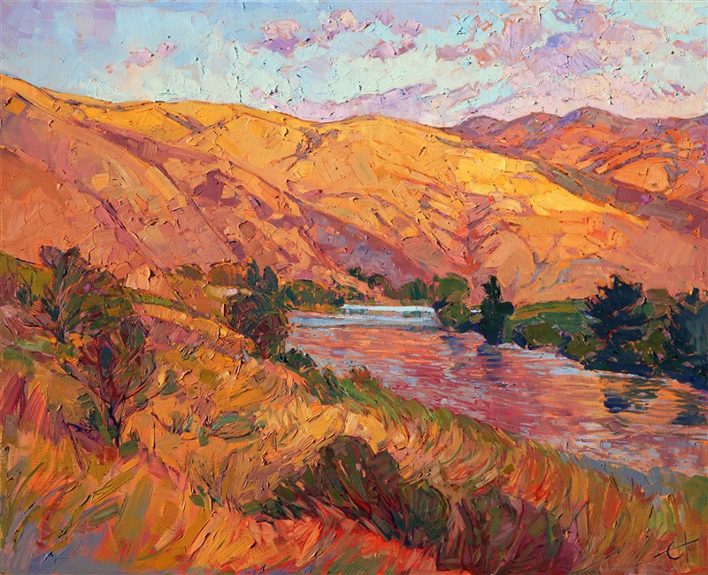 Sunset rays drench this summer countryside in rich, golden hues of buttercream and caramel. A cool river runs through the hills, the colorful reflections glittering on its rippling surface. Thick brush strokes and a confident stroke capture the movement and freshness of the outdoors.