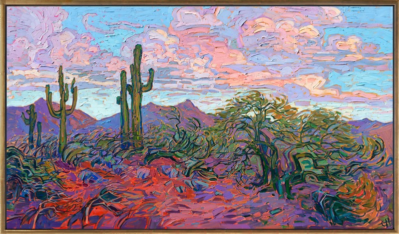 Buttercup-hued clouds drift above this Arizona landscape, and rich purple shadows stretch across the red earth. The impressionist brush strokes and thick and loose, conveying a sense of movement throughout the painting.</p><p>"Saguaro Clouds" was created on gallery-depth canvas, and the painting arrives framed in a contemporary gold floater frame, ready to hang.