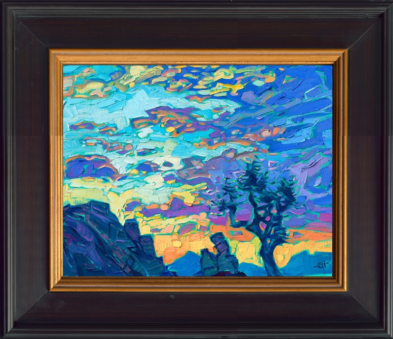 Joshua Tree National Park is captured in luscious colors of sunset blues with coppery undertones. Erin places brush strokes side-by-side, without layering, creating a highly textured mosaic of color across the canvas. </p><p>"Setting Clouds" is an original oil painting on linen board. The piece arrives framed in a black and gold plein air frame.