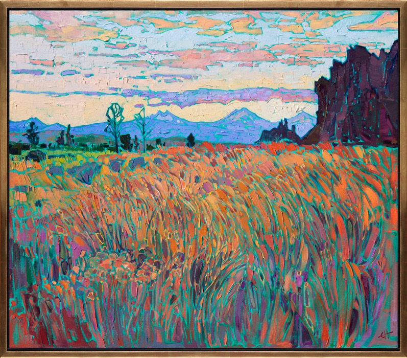 Smith Rock is a popular rock climbing destination near Bend, Oregon. You can see the peaks of the Three Sisters in the distance, blue against the warm hues of the setting sky. The long grasses in the foreground glow with the colors of summer.</p><p>"Smith Rock" was created on 1-1/2" canvas, with the painting continued around the edges. The painting arrives framed in a contemporary gold floater frame, ready to hang.