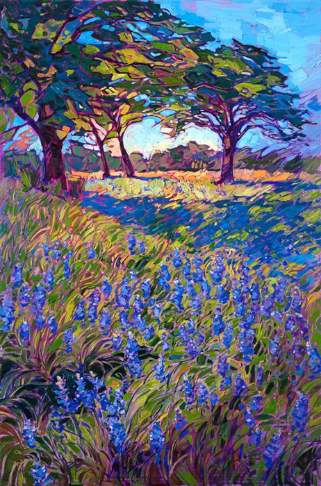 A blanket of spring bluebonnets drapes across the green grass of Texas hill country. The vivid hues of the wildflowers seem to dance among the waving greenery. Each brush stroke is loose and impressionistic, capturing the abstract sense of the landscape.</p><p>"Spring Bluebonnets" was created on 1-1/2" deep canvas, with the painting continued around the sides of the canvas. The piece has been framed in a custom gold floater frame.